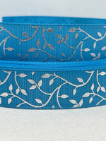 Foil embossed grosgrain ribbon and/or coordinating 1" flatbacks.  Perfect for bow making and many other crafts.