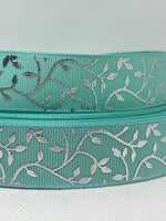 Foil embossed grosgrain ribbon and/or coordinating 1" flatbacks.  Perfect for bow making and many other crafts.