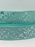 Foil embossed grosgrain ribbon and/or coordinating 1" flatbacks.  Perfect for bow making and many other crafts.
