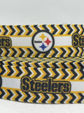 Pittsburgh Steelers inspired grosgrain ribbon and/or coordinating 1" flatbacks.  Perfect for bow making and many other crafts.