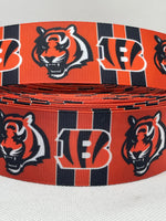 Cincinnati Bengals inspired grosgrain ribbon and/or coordinating 1" flatbacks.  Perfect for bow making and many other crafts.