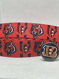 Cincinnati Bengals inspired grosgrain ribbon and/or coordinating 1" flatbacks.  Perfect for bow making and many other crafts.