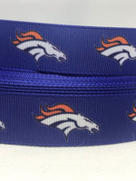 Denver Broncos inspired 7/8" & 1.5" grosgrain ribbon and/or coordinating 1" flatbacks.  Perfect for bow making and many other crafts.