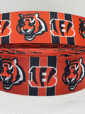 Cincinnati Bengals inspired grosgrain ribbon and/or coordinating 1" flatbacks.  Perfect for bow making and many other crafts.