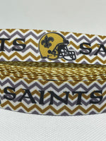 New Orleans Saints inspired grosgrain ribbon and/or coordinating 1" flatbacks. Perfect for making bows and many other crafts.