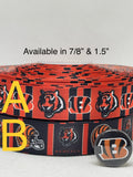 Cincinnati Bengals inspired grosgrain ribbon and/or coordinating 1" flatbacks.  Perfect for bow making and many other crafts.